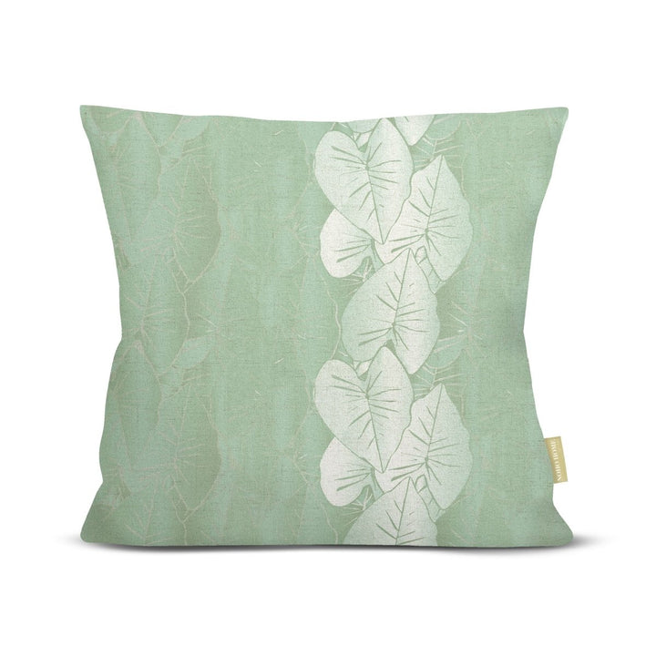 front view green Hānai premium square pillow with white kalo leaves on white background