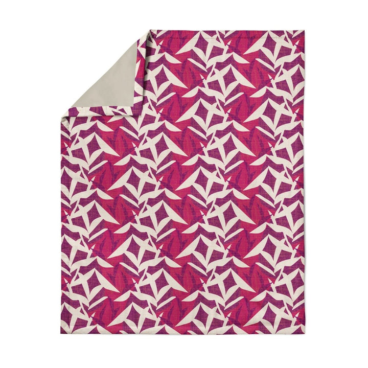 Hawaiian Airlines NOHO HOME travel blanket in pink showing full pattern on white background