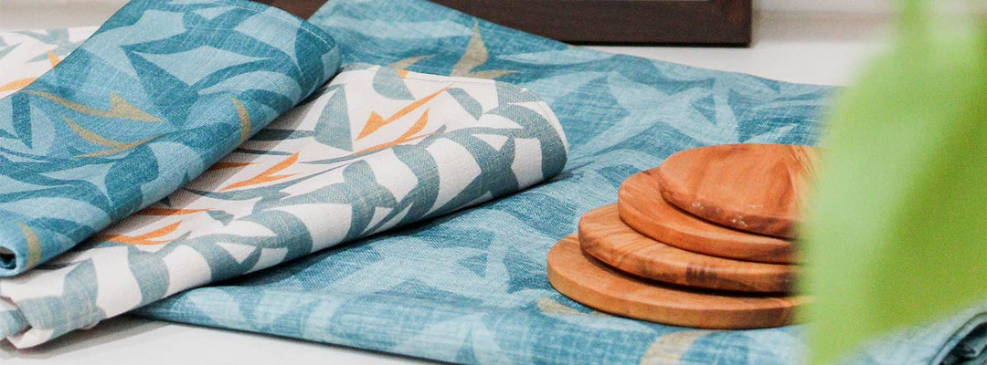 Coastal Dinner Napkins on a Dining Table in Different Blue and Pattern Hawaiian Prints