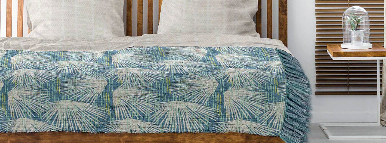 Luxury Coastal Throw Blankets Showcasing the Loulu Hawaiian Throw Blanket on a Made Bed