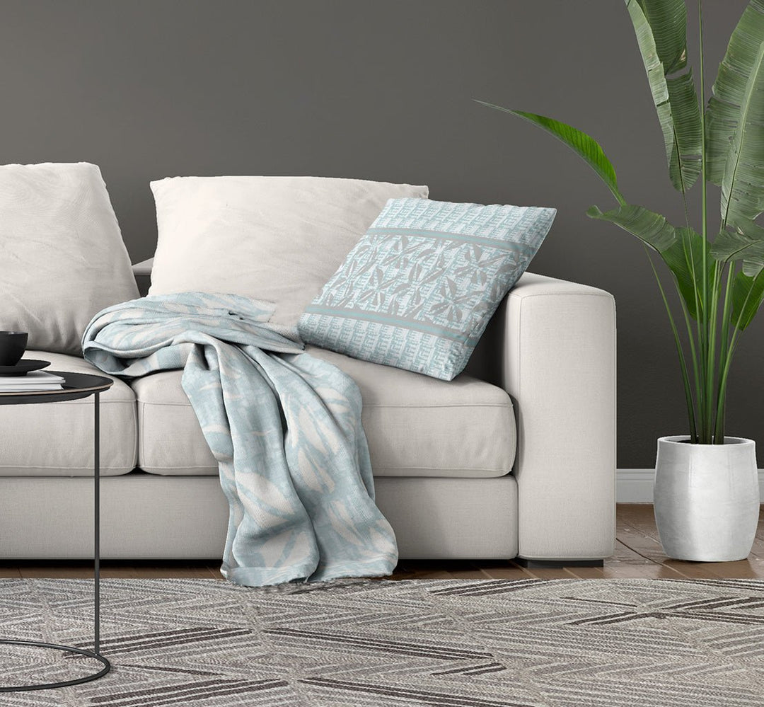 Luxury Coastal Throw Blankets Showcasing the Loulu Hawaiian Throw Blanket on a Made Bed