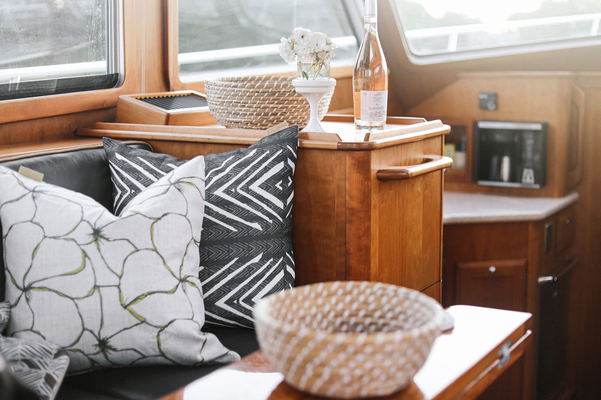 noho home pillows sitting inside a boat 