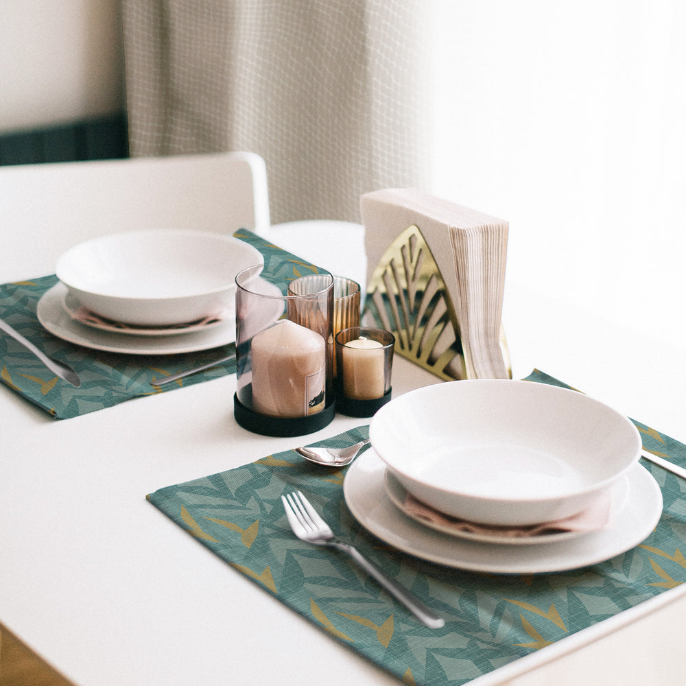 Duo place setting utilizing the Lele Placemat Set, with cutlery and white bowls and plates