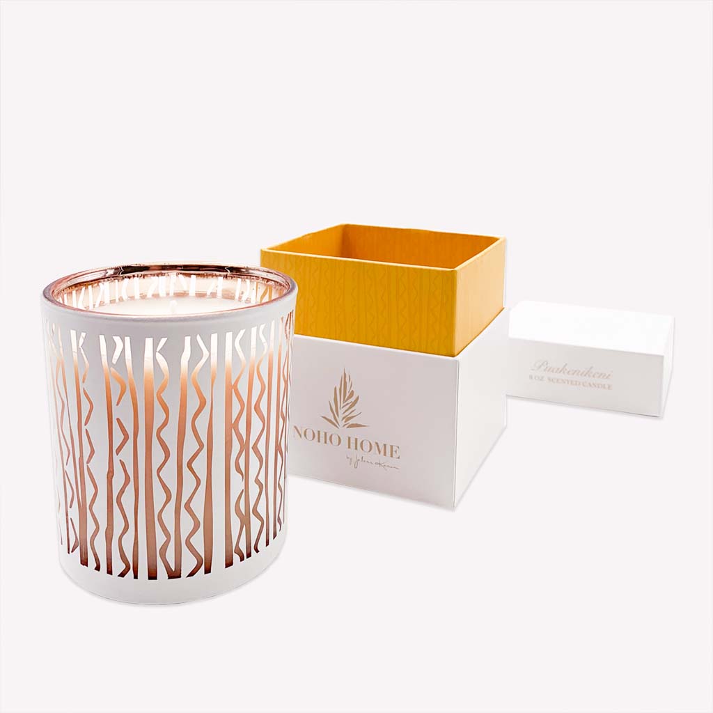 Puakenikeni candle with box next to it