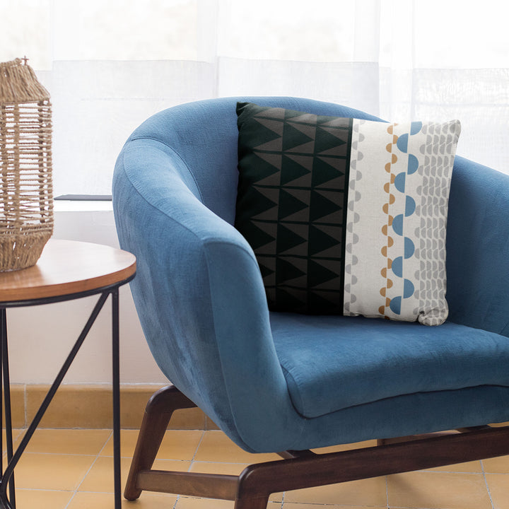 Black and Beige Tatau Pō Square Pillow Set On a Blue Modern Chair