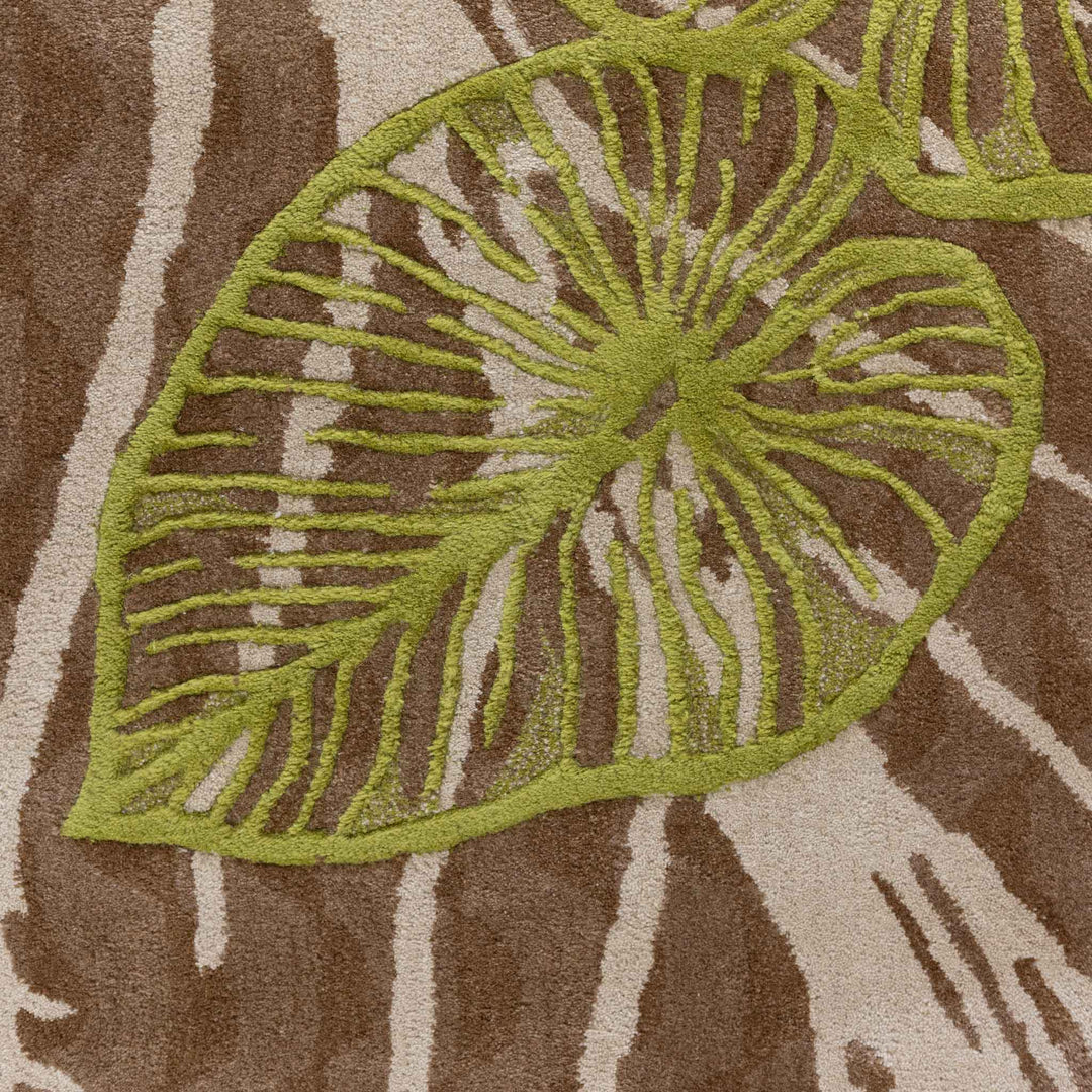 Close Up View of the Kalo Area Rug's Green Kalo Leaf Design