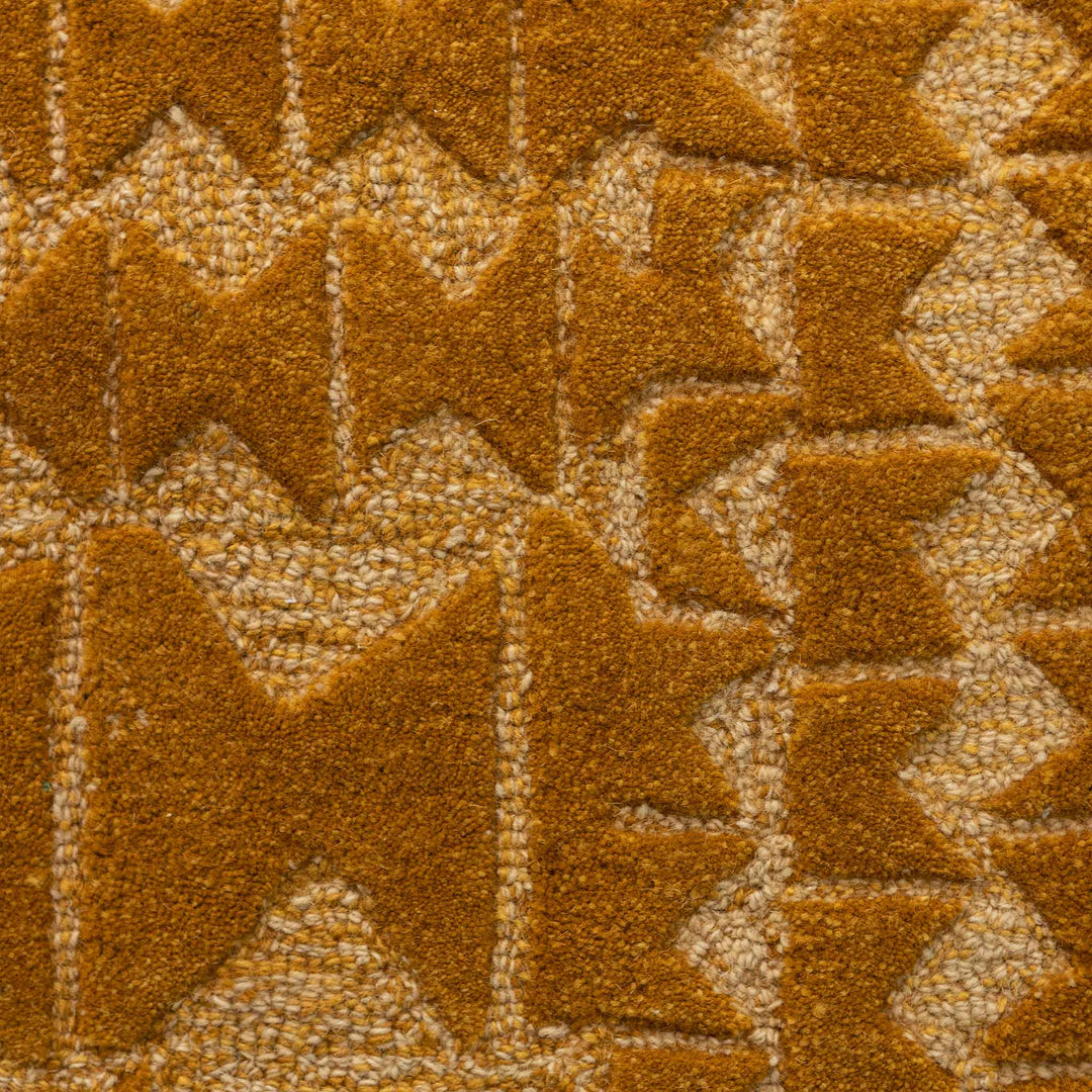 Close Up View of the Bronze and Tan Kāpili Area Rug Design Inspired by the Rectangular Wedges Used by Native Hawaiian Artisans