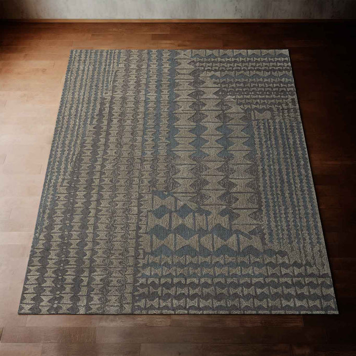 Striking Pale Blue Kāpili Area Rug Laying on a Hardwood Floor