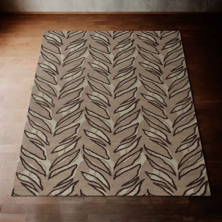 Taupe and Black Kī Area Rug Laying Flat on a Wooden Floor