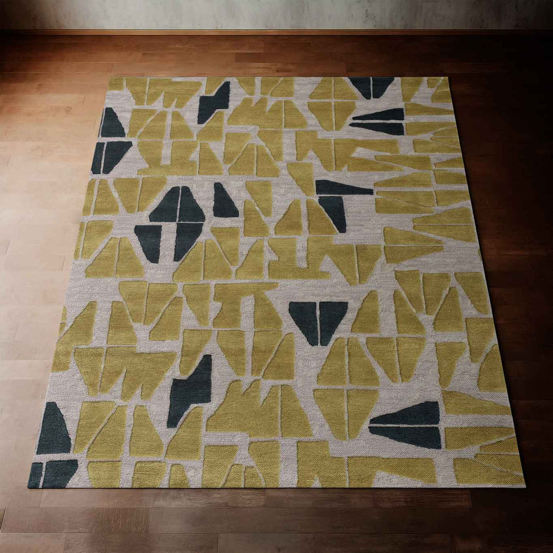 Beautiful Chartreuse Kinona Area Rug Laying on a Dark Hardwood Floor