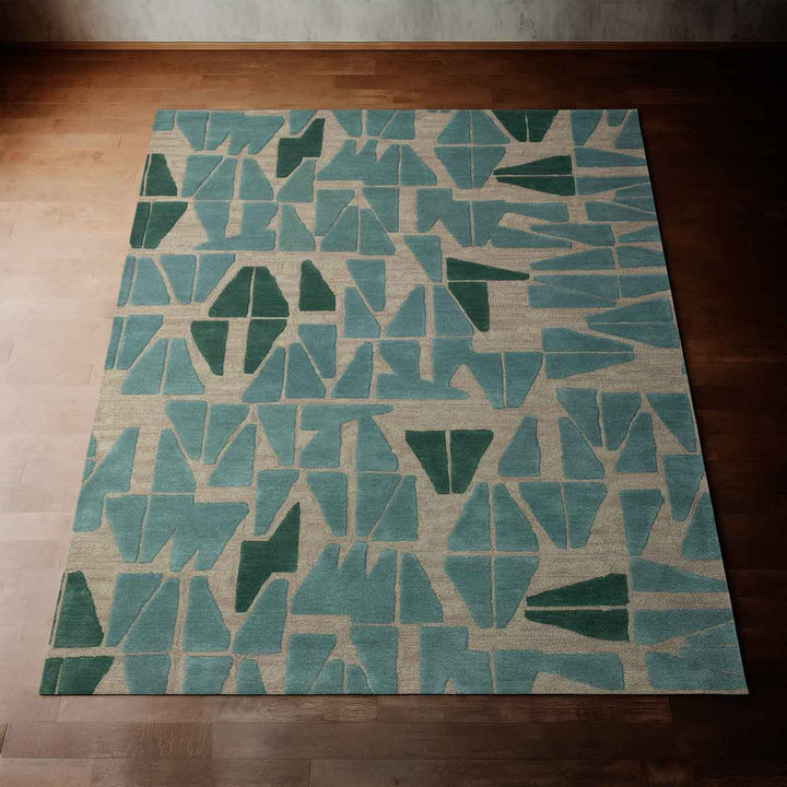 Stunning Teal Kinona Area Rug Laying on a Dark Wood Floor