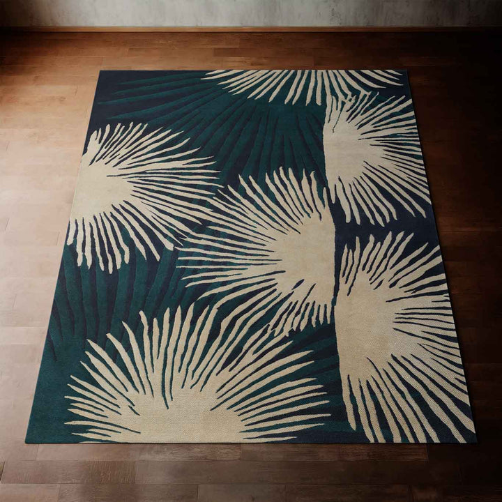 Navy Coastal Hawaiian Design Loulu Area Rug Laying on a Wooden Floor