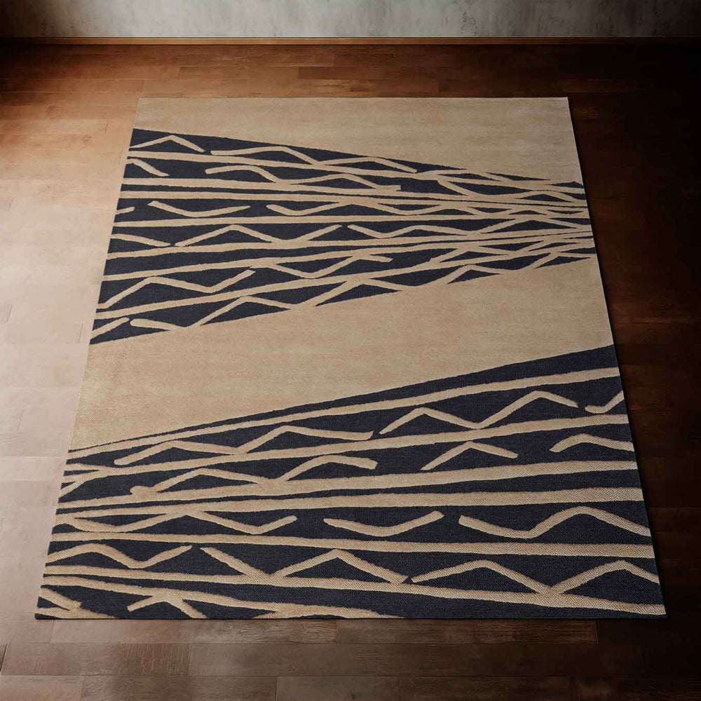 Charcoal and Taupe Niho Kila Coastal Hawaiian Area Rug Laid Out Flat on a Hardwood Floor