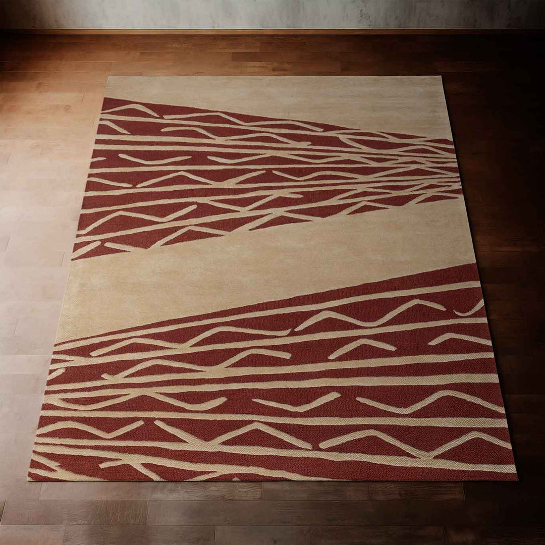 Red Burgundy Eye Catching Niho Kila Area Rug Laying on a Wooden Floor