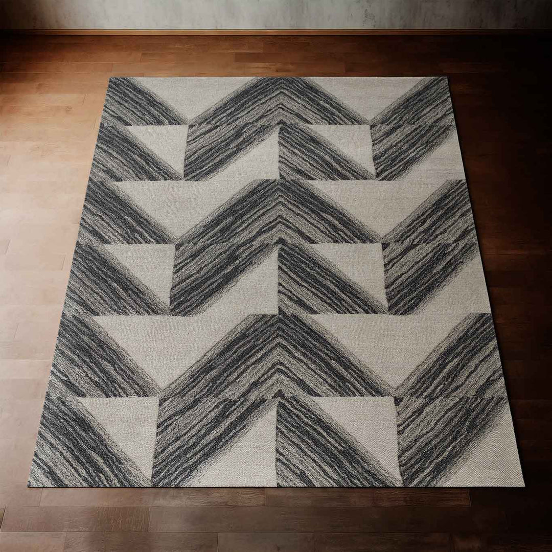 Charcoal Color Hawaiian Designed Pali Area Rug Laying Flat on a Hardwood Floor