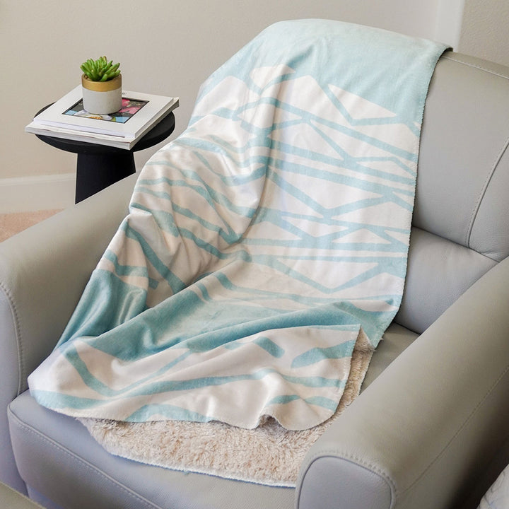 aquamarine cozy throw draped over chair