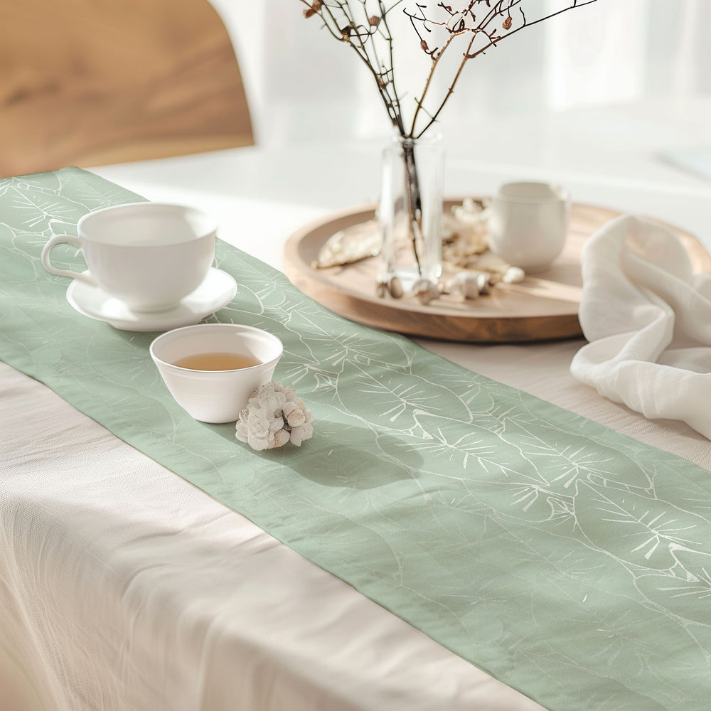 Hānai premium table runner in sage on table