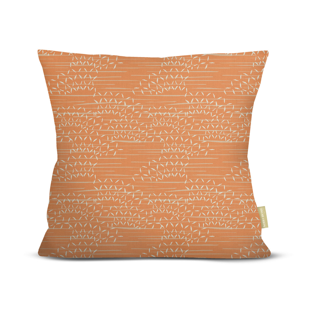 front view of Kaha square pillow in orange on white background