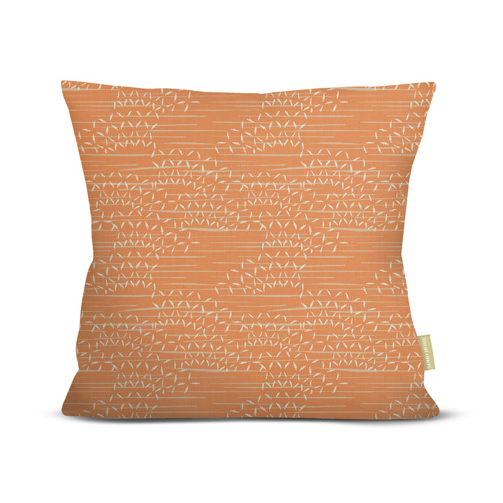 front view of Kaha square pillow in orange on white background