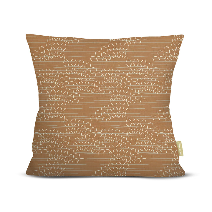 front view of Kaha square pillow in earth on white background
