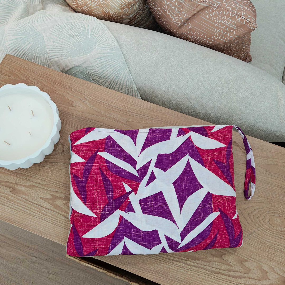 Hawaiian Airlines NOHO HOME travel blanket in pink in overhead view