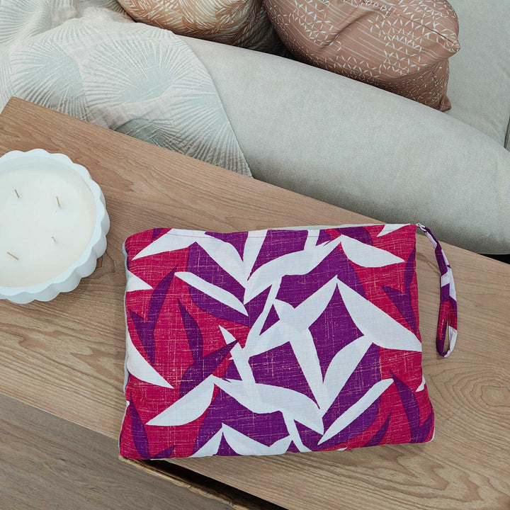 Hawaiian Airlines NOHO HOME travel blanket in pink in overhead view