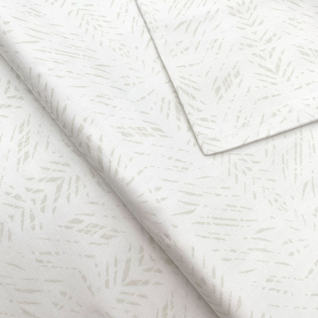 Close view of the white Batik print on a NOHO HOME bed pillowcase