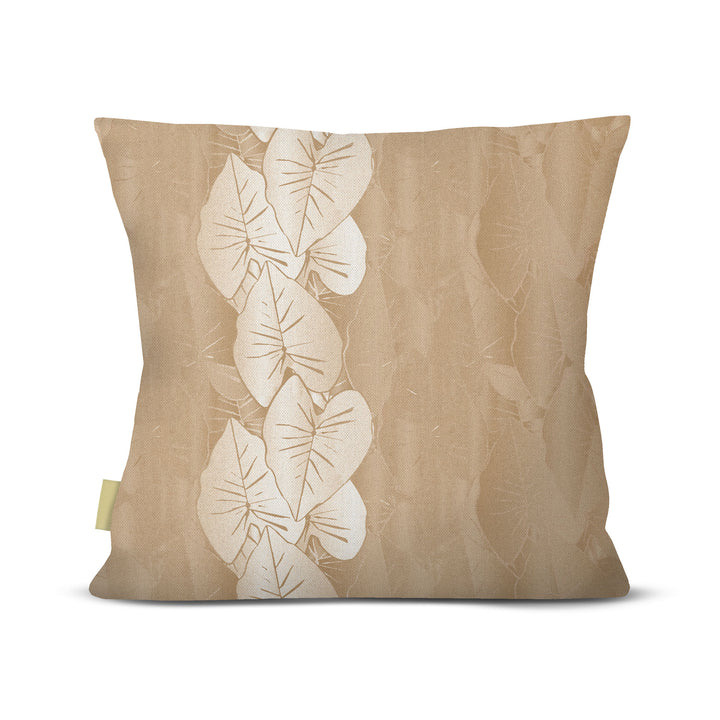 Beige pillow with white kalo leaf pattern on a beige background