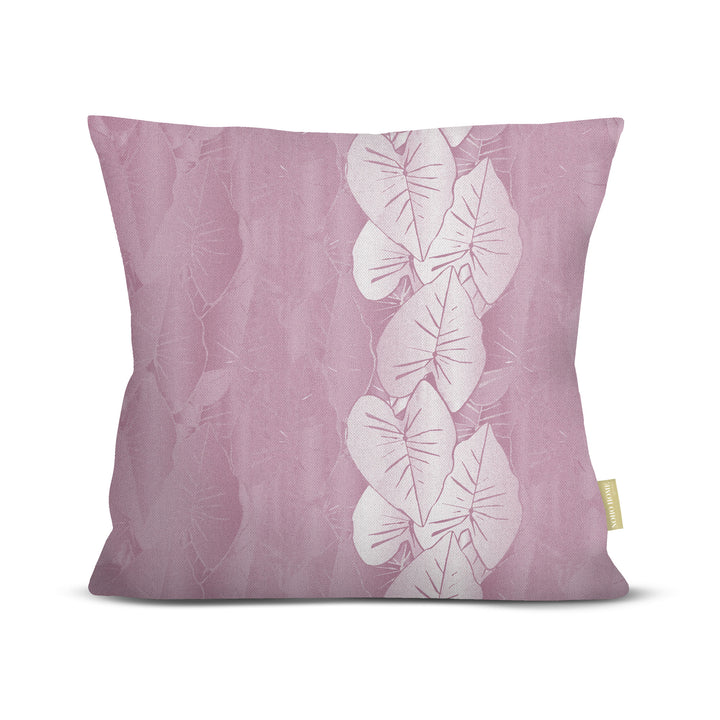 Lavender pillow with white kalo leaf design on a white background.
