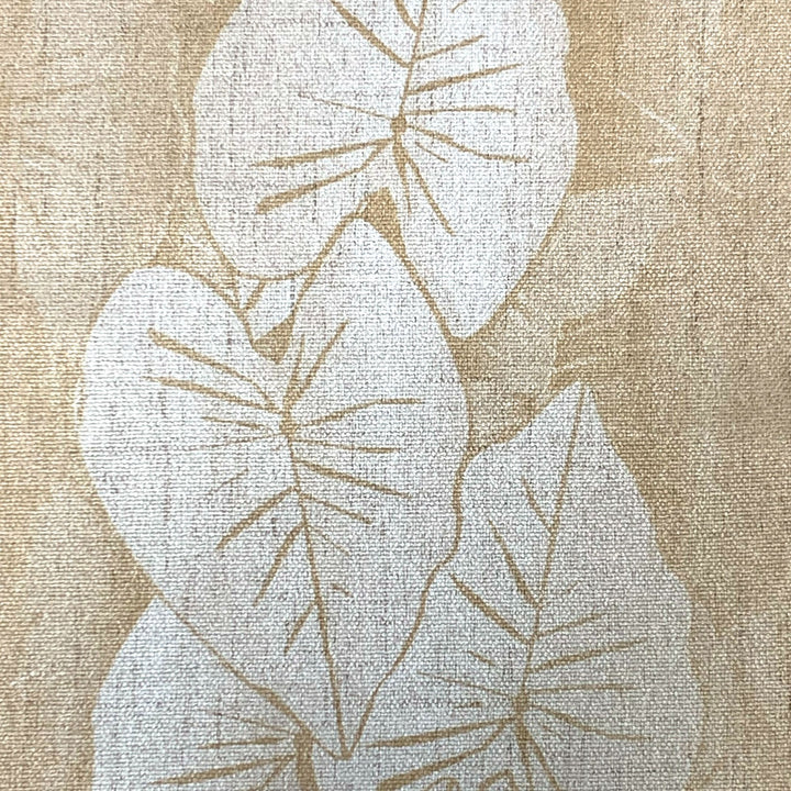 Textured fabric with leaf pattern in beige and brown tones
