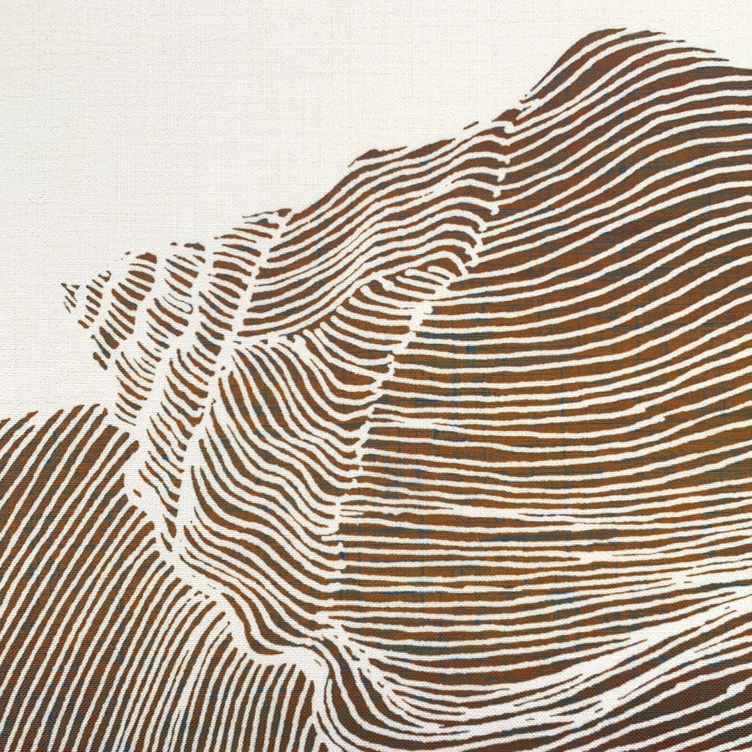 Textured brown and beige pattern on a fabric surface