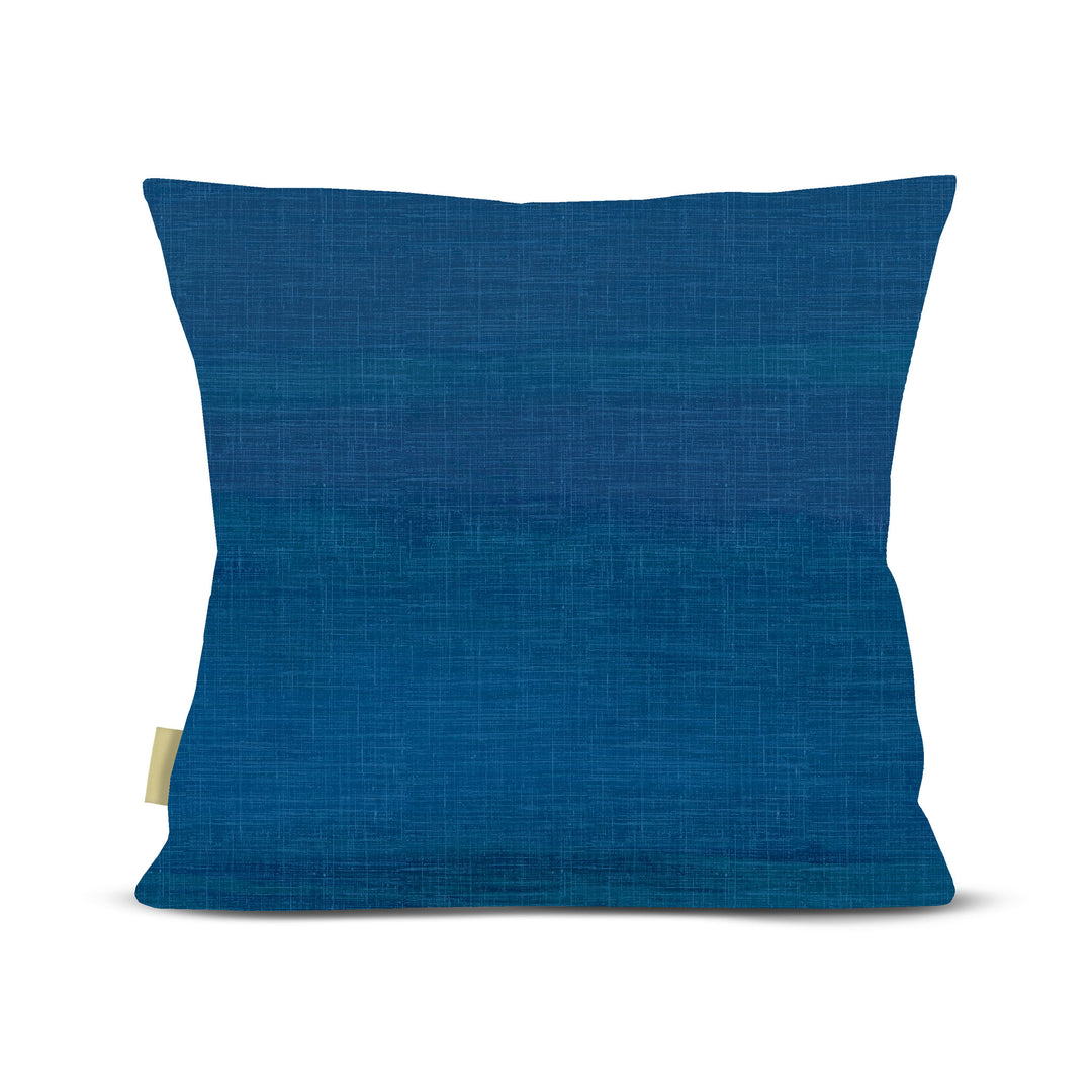 Back of pillow, Blue pillow with a small tag on a white background