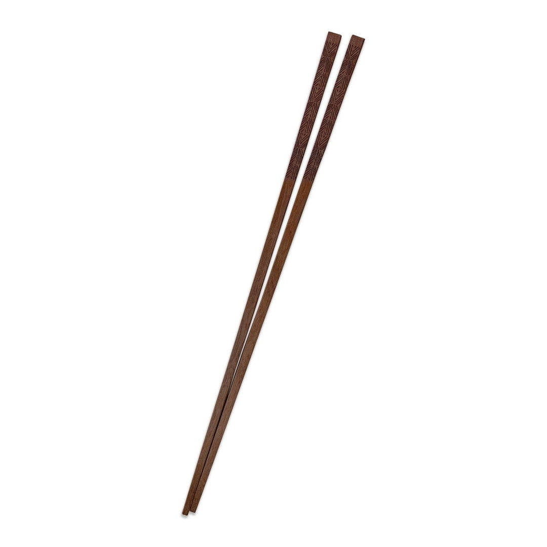 One Set of ʻAkahi Chopsticks On a White Background