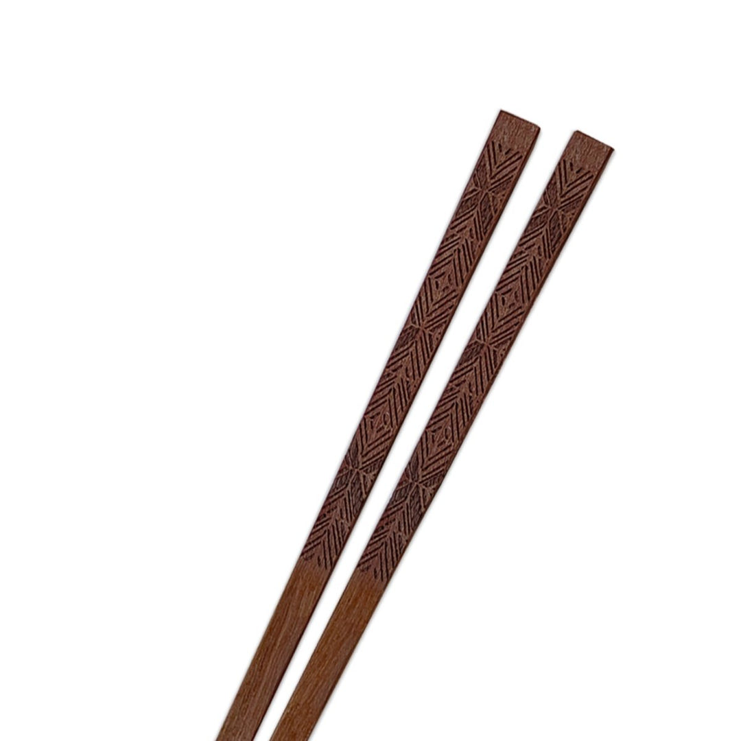 Closeup of the ʻAkahi Chopsticks Hawaiian Wood Imprint