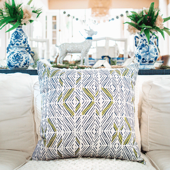 Moss & Navy & Ivory ʻAkahi Square Pillow Set On a White Fabric Couch