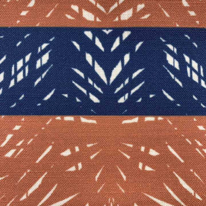 Closeup of the Rust & Navy Batik Lumbar Pillow Hawaiian Print