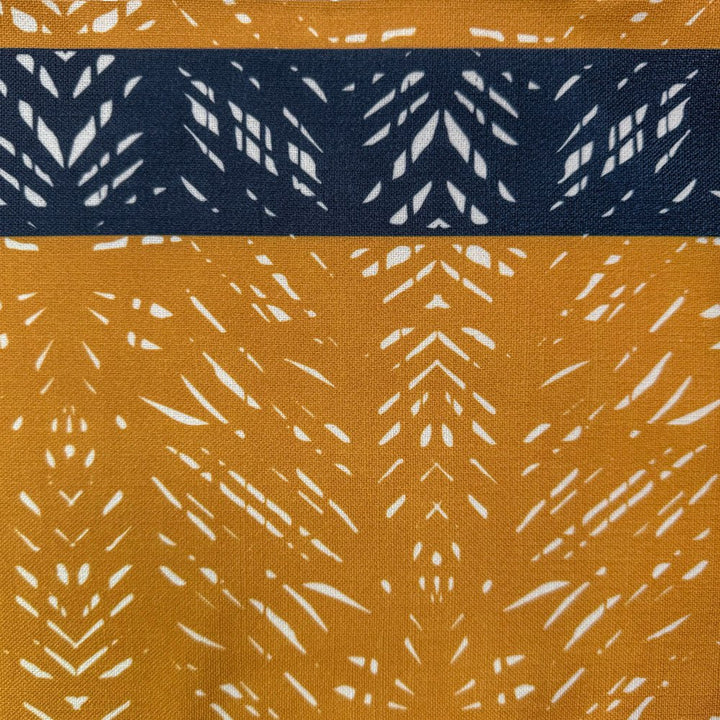 Close up of Batik Lumbar Pillow in Tumeric