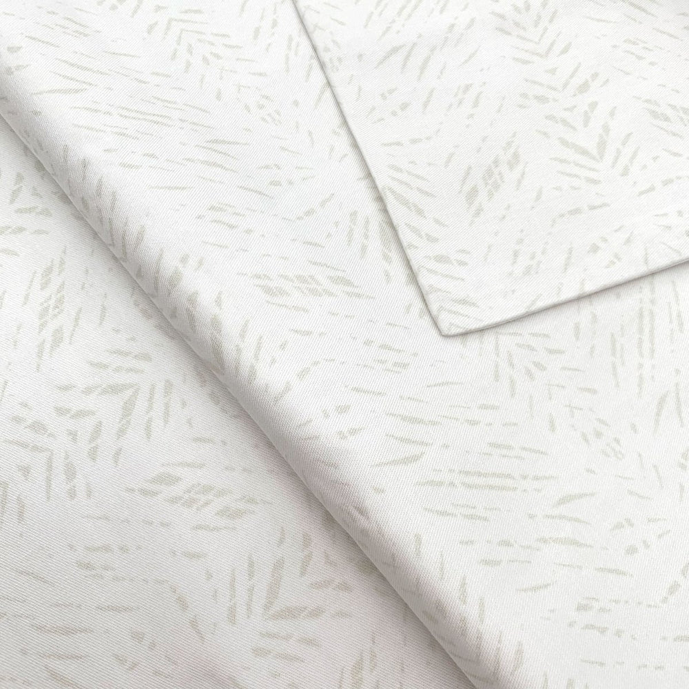 Close view of the white Batik print on a NOHO HOME bed pillowcase