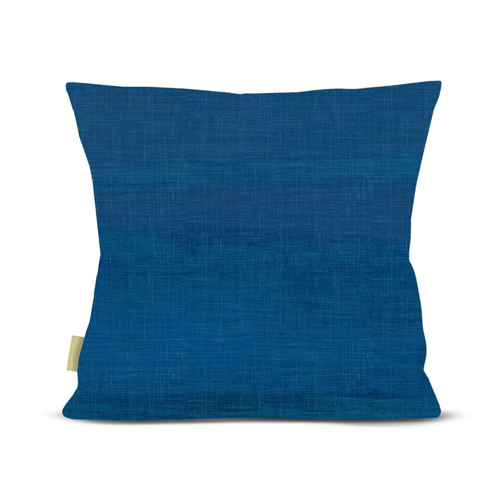Back of pillow, Blue pillow with a small tag on a white background