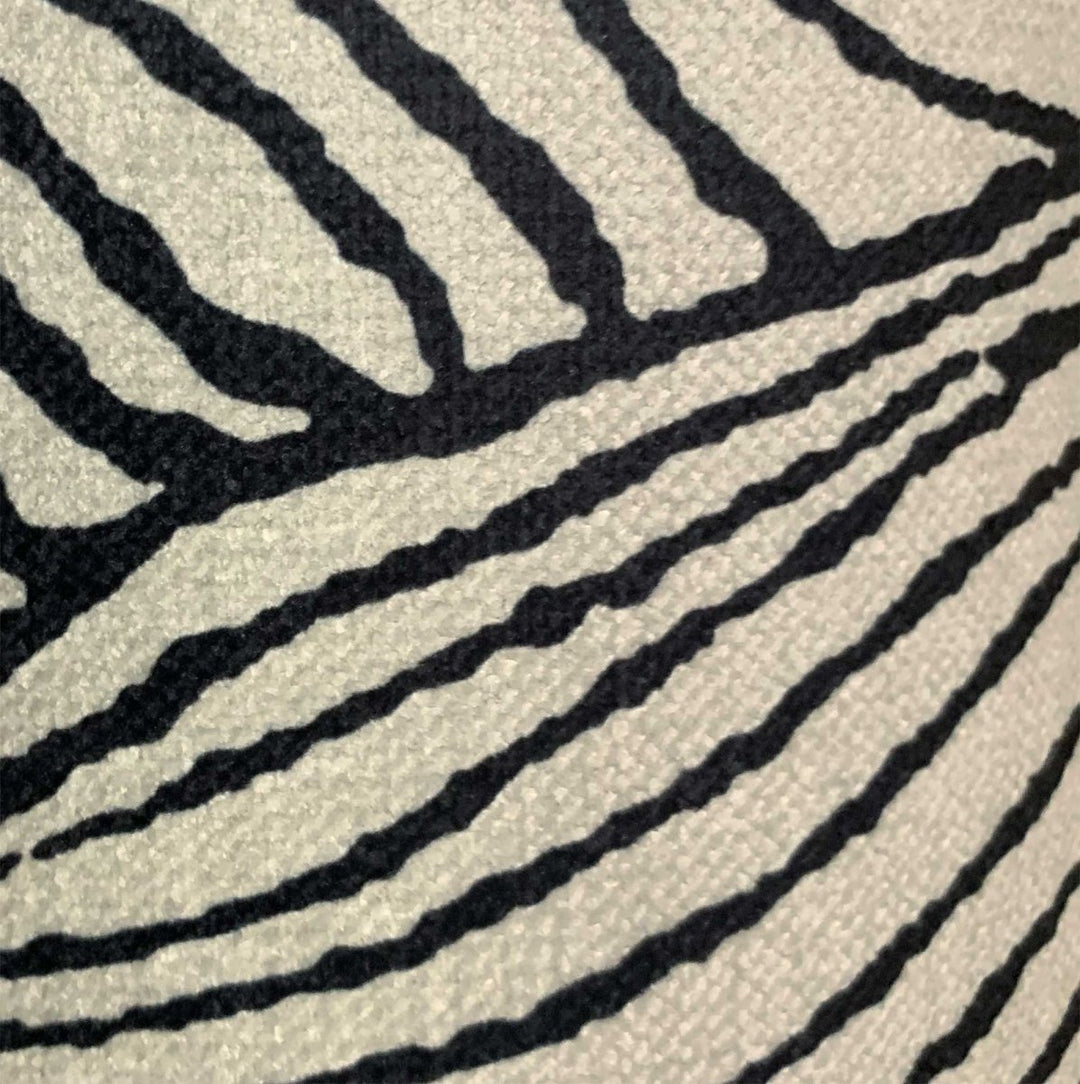 A close up look at the gardenia luxury black and white fabric throw.