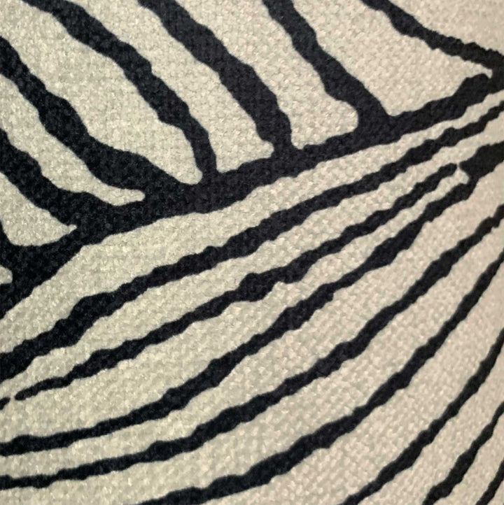 A close up look at the gardenia luxury black and white fabric throw.