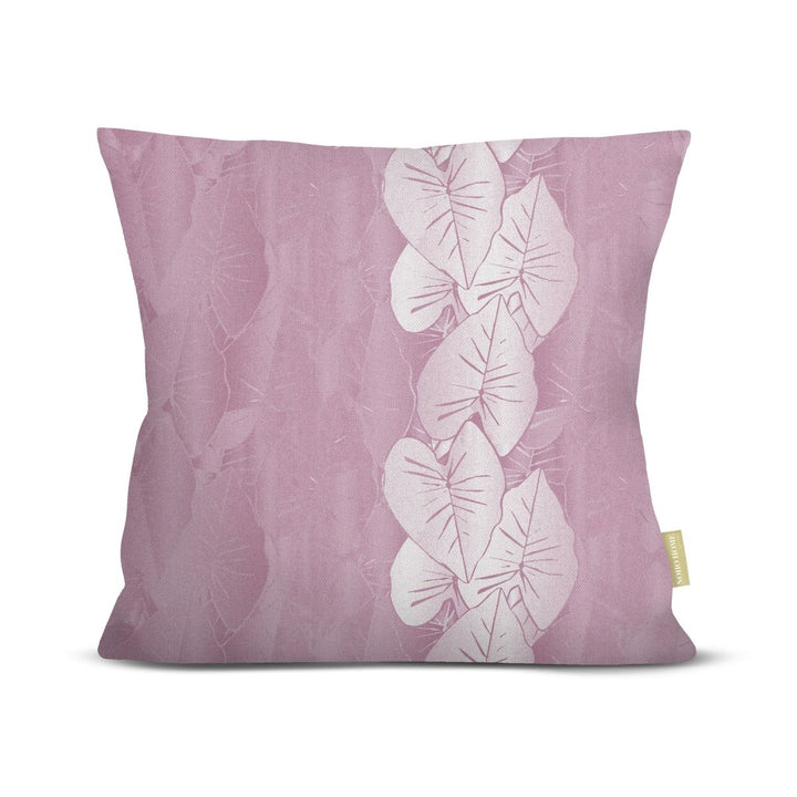 Lavender pillow with white kalo leaf design on a white background.