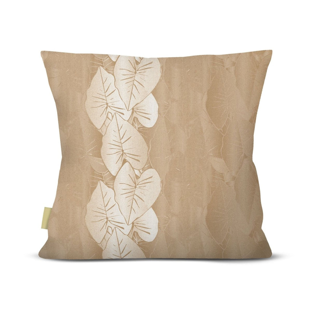 Beige pillow with white kalo leaf pattern on a beige background