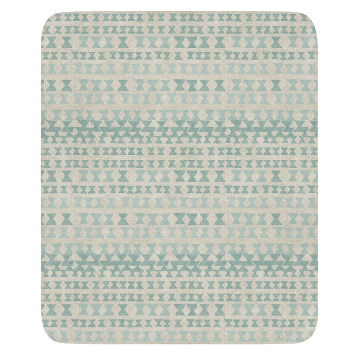 A Kapili Cozy Throw with a traditional Hawaiian Kapili pattern, inspired by woodworking technique.