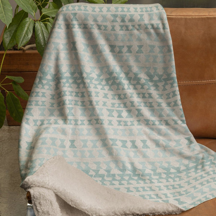 kapili aquamarine cozy throw on chair