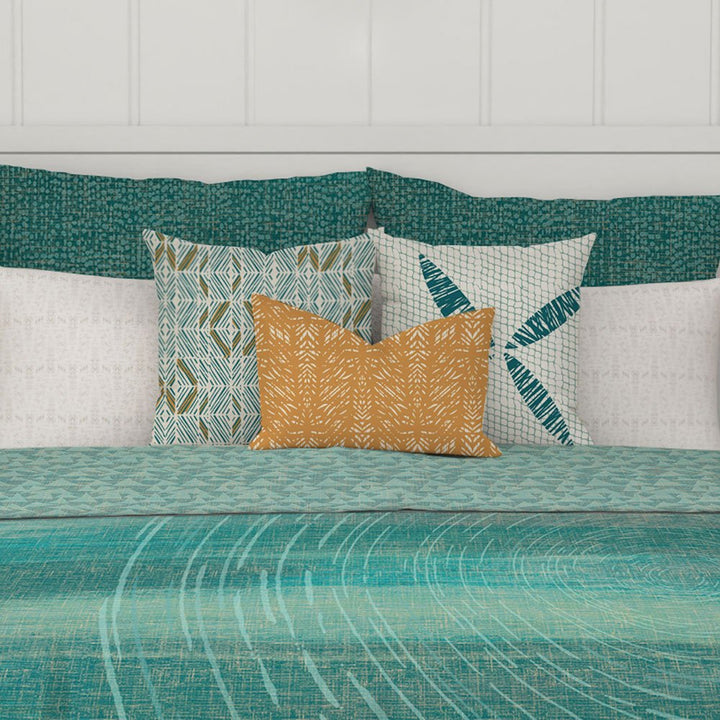 Close up of bed set with navigation-inspired teal Kilo Hoku Duvet 