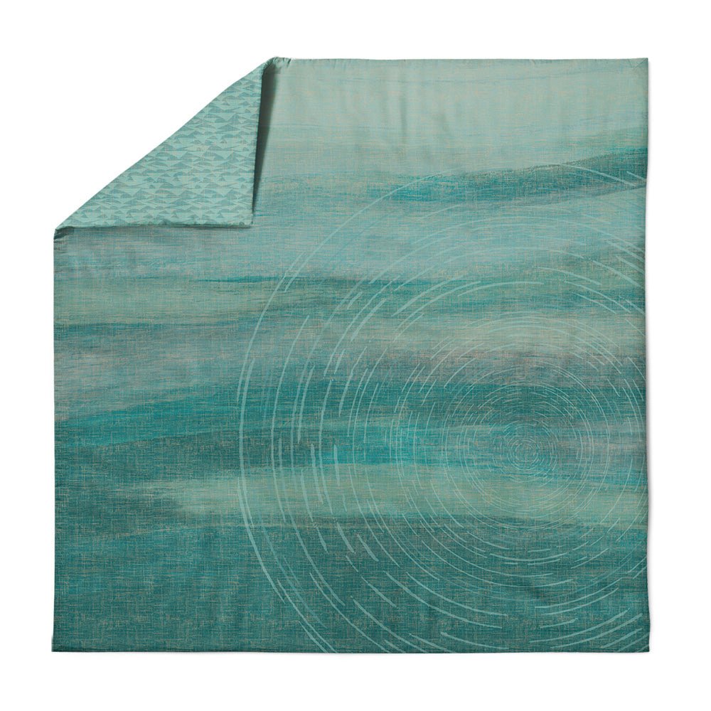 Flatlay of stargazing teal Kilo Hoku Duvet on white background