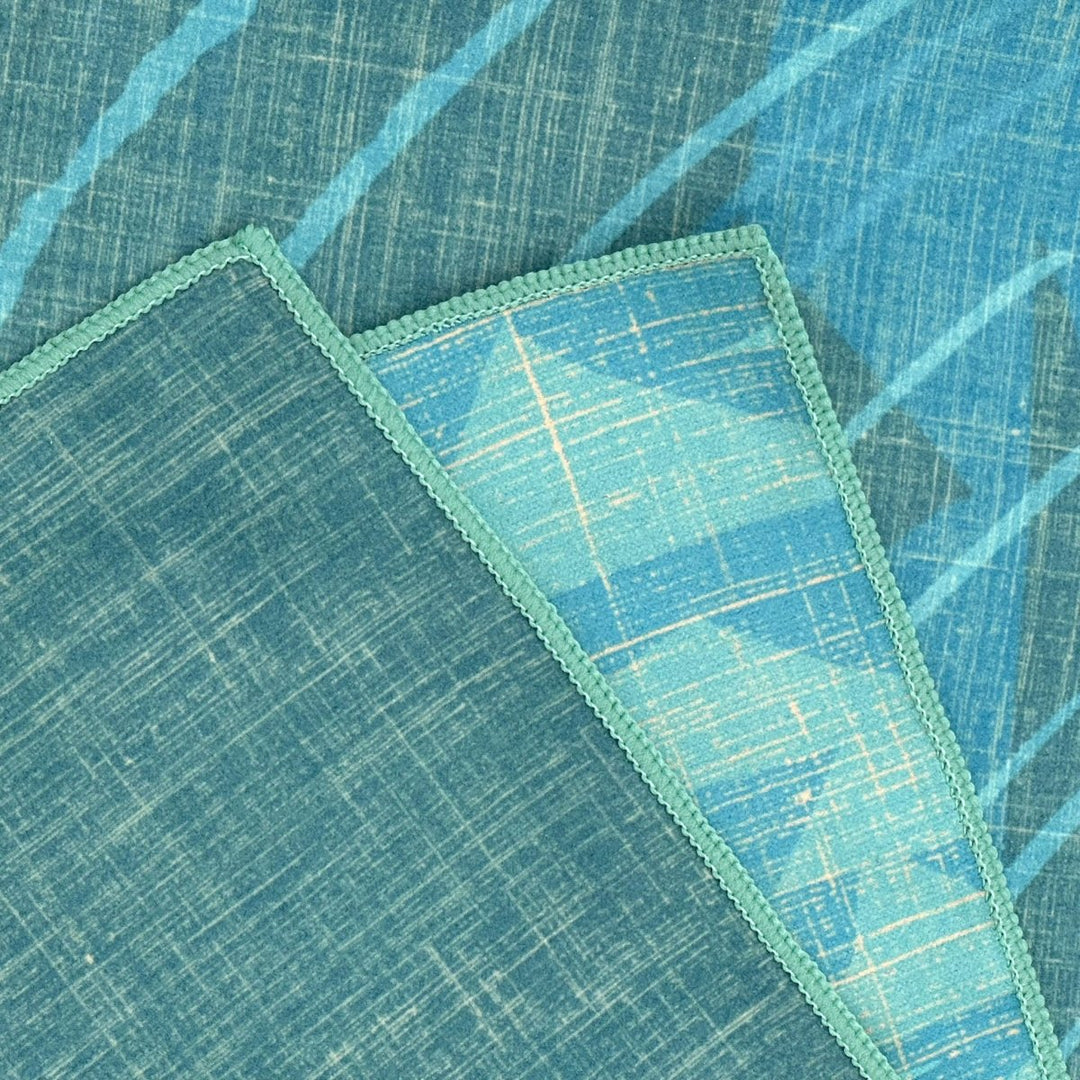 More close-ups of front and back of Kilo Hōkū Microfiber Beach Towel, as well as the edge stitching detail