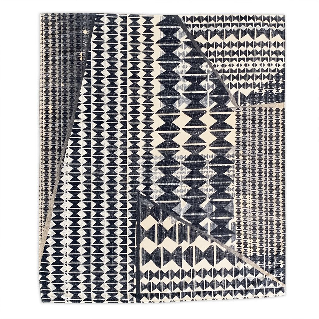 decorative kipola throw flatlay of dark navy and white Hawaiian pattern