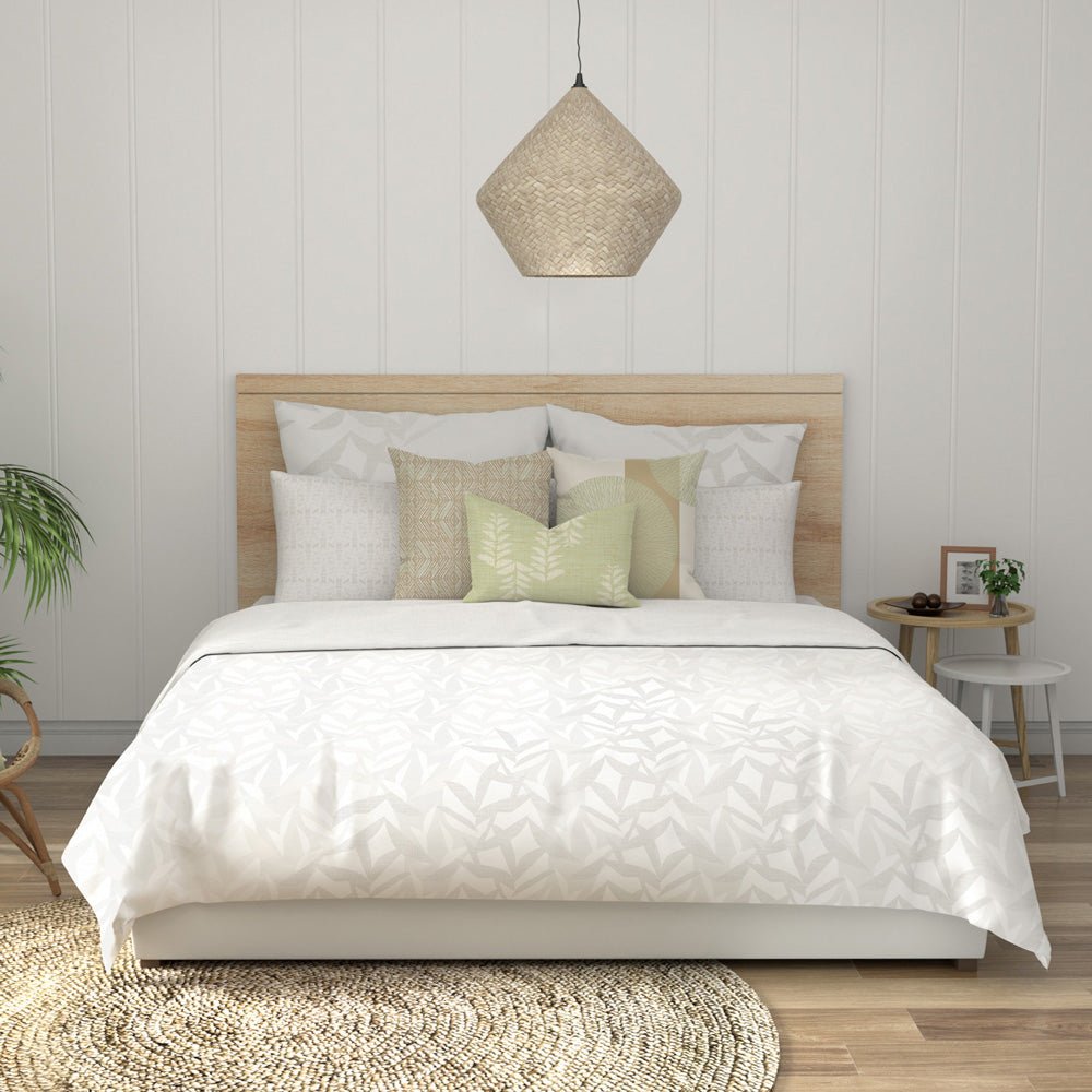 Two Lele Euro Sham Pillows Set Behind More Decor Pillows on a King Size White Comforter Bed